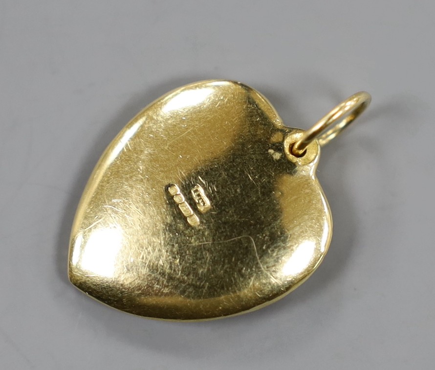 A modern 18ct gold and pave set diamond heart shaped pendant, overall 27mm, gross weight 11.3 grams.